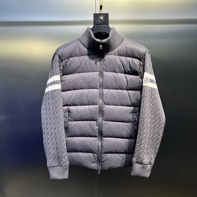Grey padded jacket with knitted sleeves